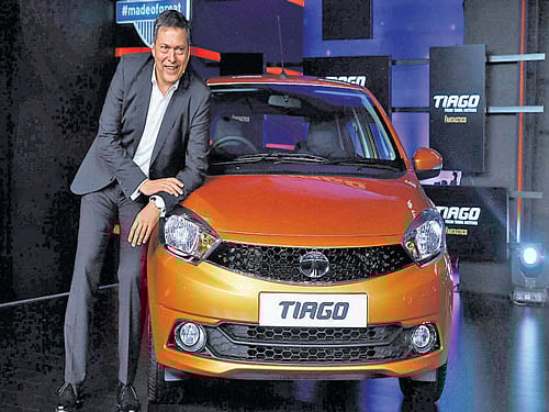 Tata Motors Chief Executive Officer Guenter Butschek unveils the Tiago in Mumbai on Wednesday. Reuters