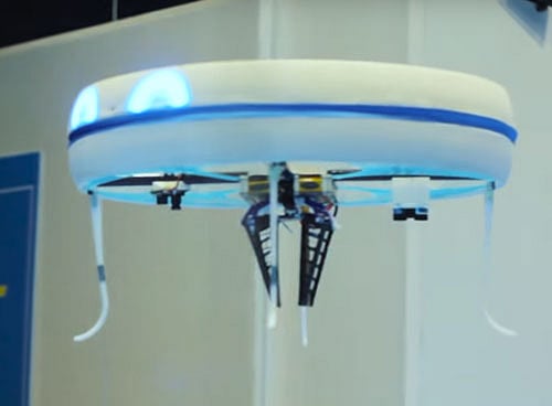 The cafe is offering four different alcoholic and non-alcoholic cocktails, which are either bright blue or green -- the same colour as the drone's eyes. Screen grab