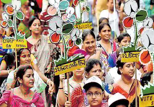 TMC activists at an election campaign of West Bengal Chief Minister Mamata Banerjee at Bhawanipore  constituency in Kolkata on Sunday. PTI