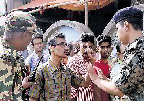 A voter argues with Central Force Jawans near a polling station during 4th phase of West Bengal  Assembly elections in North 24 Pargana on Monday. PTI