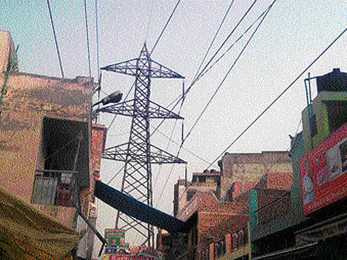 Around 10,000 households in 40 unauthorised colonies live under the state power transmission lines. DH