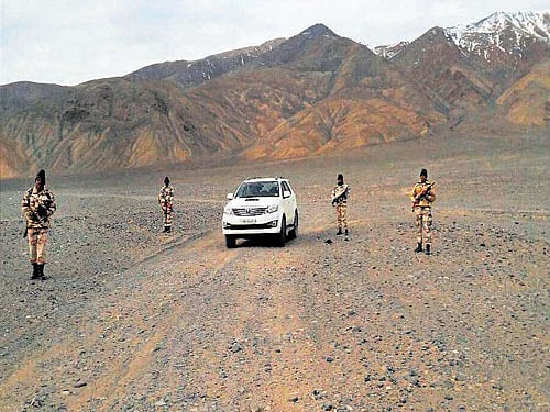 ITBP troops with their SUV at forward areas along the China border. PTI