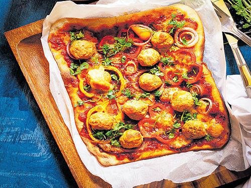delicious 'Tandoori meatball pizza' by Parvathy and (below) 'Beet flat bread' prepared by Ambica.
