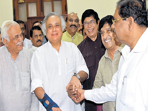 Congress candidates, former union ministers Jairam Ramesh, Oscar Fernandes and former IPS officer K C Ramamurthy, share a lighter moment after filing their nominations for the Rajya Sabha elections in the city on Monday. State Ministers R V Deshpande and G Parameshwara are seen. DH Photo