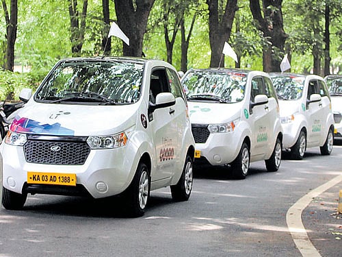 Electric cars take part in a rally to spread awareness about the environment. dh pHOTO