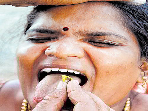 People being administered fish medicine, by Bathini family on the occasion of 'Mrigasira Karthi' in Ranga Reddy district. File photo