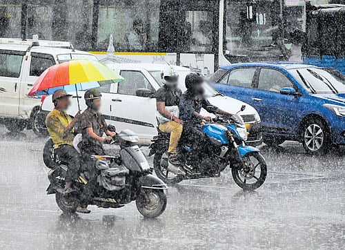struggling Poor infrastructure in the city makes life difficult for commuters during the rains.