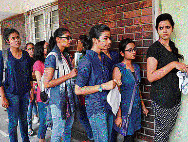Students waiting in a queue to complete their admission process at a college in New Delhi on Tuesday.