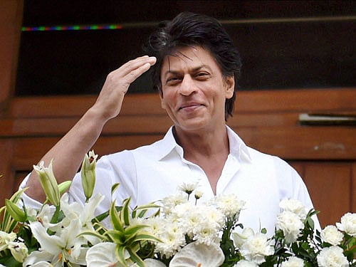 Bollywood actor Shahrukh Khan waves to his fans on the occasion of Eid-ul-Fitr in Mumbai on Thursday. PTI Photo