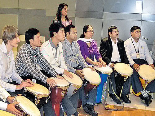 BONDING BEATS A drum circle like this is often organised by corporates to bring about synergy during leadership trainings and team-building exercises. The Indian cricket team unwound its preparatory camp for the West Indies tour, in Bengaluru recently, with a similar drum circle. DH File photo.