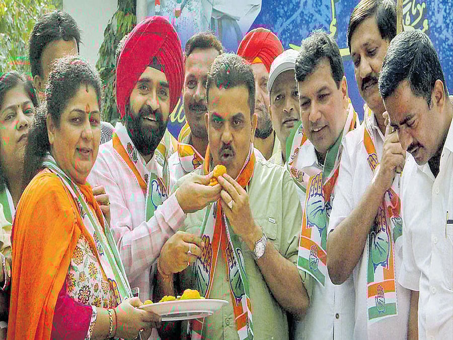 Mumbai Congress president Sanjay Nirupam celebrates on Wednesday after the Supreme Court restored the party's government in Arunachal Pradesh. PTI