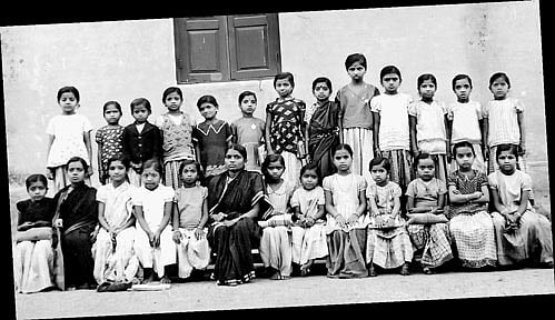 (Sitting, from left) Gowramma, Ganga, Bassamma (fourth), Bala, Puttamma (teacher), Arokya Mari, Chikki, Ratna (10th),  Mahadevi, the author and Putti. (Standing) Kamala, Sidamma, Rangamma (5th), Susheela, Bhagya (8th), Prabha,  Gopalamma and Putta Gowri (13th).
