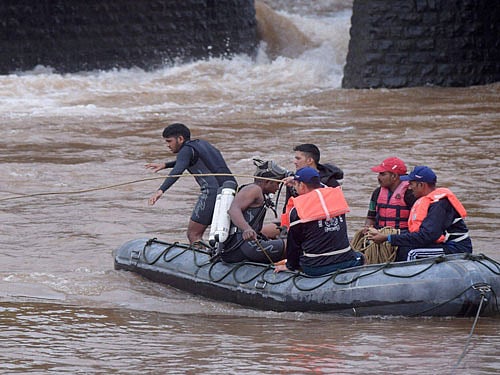 Indian Navy personnel carry out rescue work in Savitri River near the collapsed Mahad-Poladpur bridge on the Mumbai-Goa highway in Mahad, Raigad district on Thursday. PTI Photo