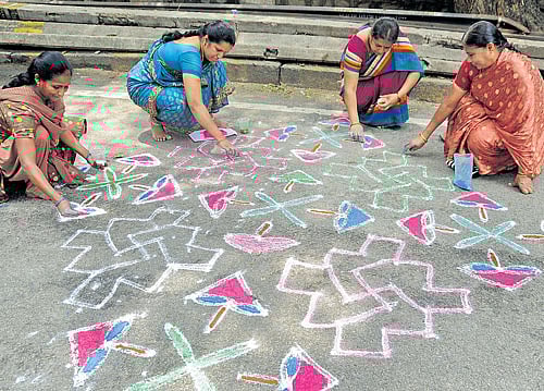 good tidings 'Rangolis' are said to bring in good luck, wealth and prosperity. dh photo by Ranju P