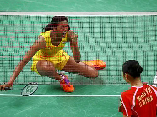 P.V. Sindhu (IND) of India celebrates after winning her match against Wang Yihan (CHN) of China. REUTERS