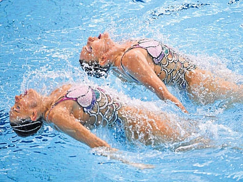 mermaids Russia's Natalia Ishchenko (left) and Svetlana Romashina during the duet technical routine in the final of synchronised swimming at the Maria Lenk Aquatics. AFP