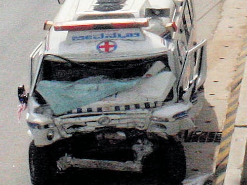 The mangled remains of the ambulance that rear-ended a bus. DH photo