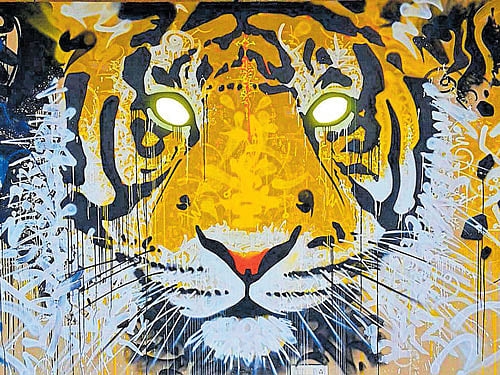 A painting of a tiger with reflective eyes by French graffiti artist Marko93.