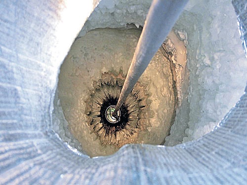 hunt for the particle An optical sensor begins its 2,500-metre journey down a borehole to become part of the IceCube neutrino detector in Antarctica.  photo courtesy: jim Haugen, IceCube/NSF