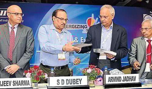 Chief Secretary Arvind Jadhav (third from left) releases the theme paper at a conference on 'Smart-Reliable-Sustainable Power' organised by the CII in Bengaluru on Monday. Managing Director, ABB India Ltd, Sanjeev Sharma, Chairman, Central Electricity Authority, S D Dubey, and Chairman (PRES) CII Southern region, S Chandrashekhar, look on. DH Photo