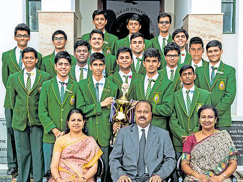 The Bishop Cotton Boys' High School which won the  'Outstanding Delegation' title at Harvard Model UN recently. Students pose with the trophy. (From left) Mercy Stanley,  co-ordinator for MUN, John Zachariah, principal, and Nanita Reuben, vice-principal, are seen. dh photo