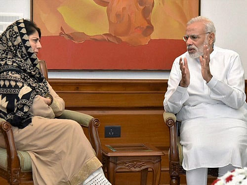 Prime Minister Narendra Modi with Chief Minister of Jammu and Kashmir Mehbooba Mufti at a meeting in New Delhi on Saturday. PTI Photo/PIB