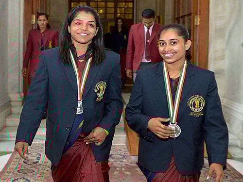Bronze medal winner wrestler Sakshi Malik and gymnast Dipa Karmakar after receiving Rajiv Gandhi Khel Ratna Award from President Pranab Mukherjee at the National Sports and Adventure Award 2016 function at Rashtrapati Bhawan in New Delhi on Monday. PTI Photo