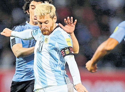 Lionel Messi nets the solitary goal for Argentina against Uruguay. REUTERS