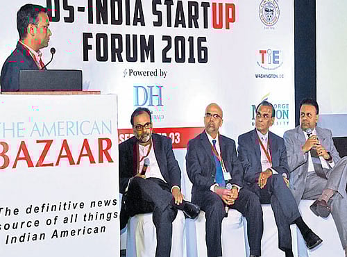 Sridharan, co-founder & editor-in-chief, Nyusu Digital Media, moderates a discussion with panellists (fromleft) Dr Satyam Priyadarshy, president of TiE DC, LLC Vinson X Palathingal, founder of Amaram Technologies, Dr Ram Reddy, chairman, board of directors, Communi Clique, and Sri Peddu, founder and MD, Power house Ventures, at the US-India Startup Forum 2016 organised by The American Bazaar in Bengaluru on Saturday. DH PHOTO