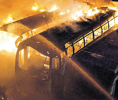 KPN travel buses set afire near Nayandahalli on Monday. dh phot0/ B K Janardhan
