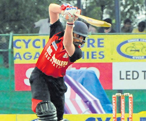fetch that! Bellary Tuskers' Rohan Kadam drives one to the boundary during his 53 against Belagavi Panthers in their KPL match at Hubballi on Monday. DH photo