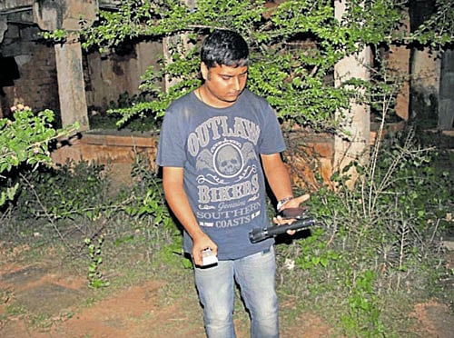 A member of Team Pentacle in action at a haunted bungalow in Chikkamagaluru.
