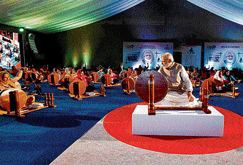 Prime Minister Narendra Modi at a ceremony to distribute charkhas to women in Ludhiana on Tuesday. PTI