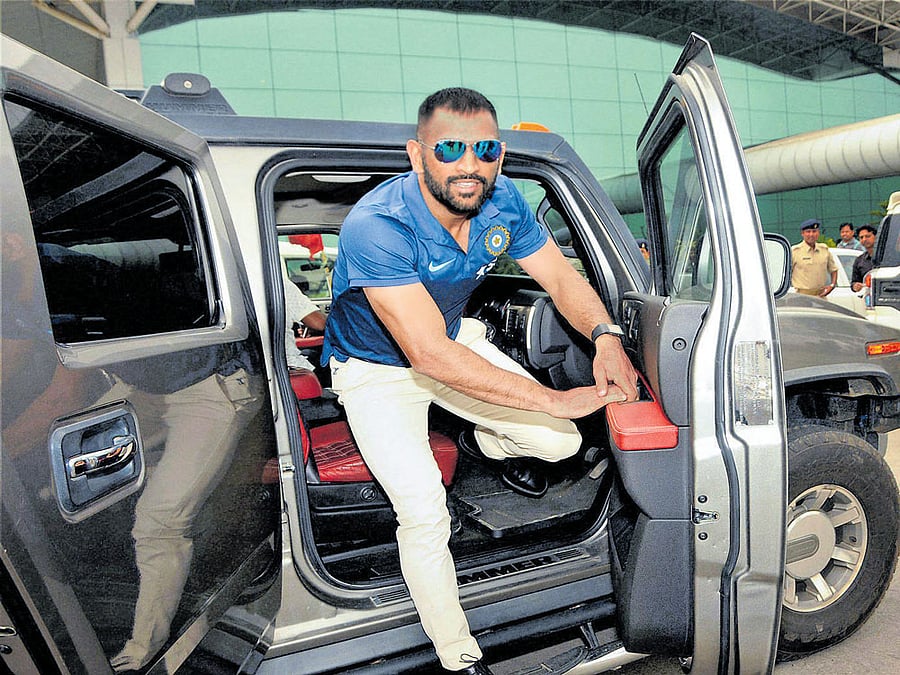 Mahendra Singh Dhoni arrives at the Birsa Munda airport in Ranchi in his Hummer on Thursday. PTI
