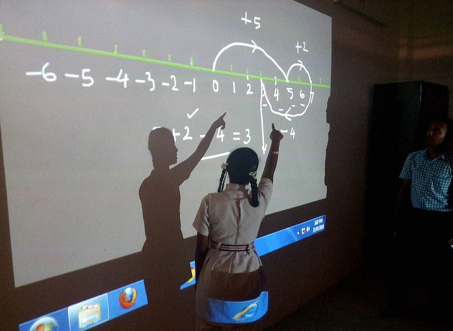 A school girl attending Maths video lecture at school in a naxal-affected area Kanker in Chattisgarh. PTI Photo