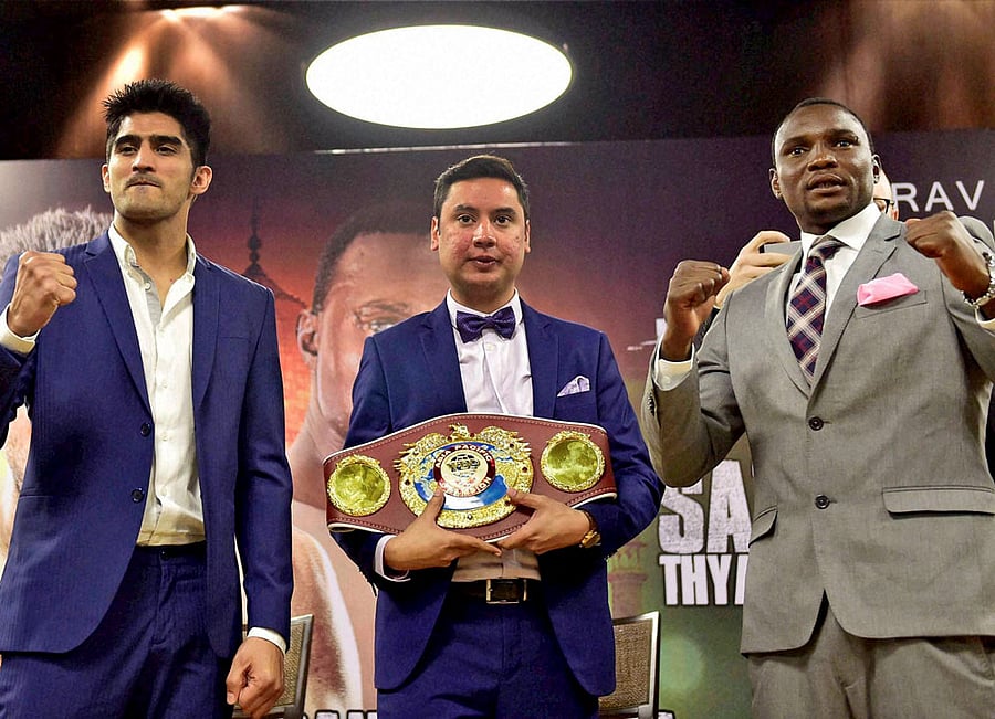 Indian boxing star Vijender Singh (L) and Francis Cheka, current intercontinental Champion with Neerav Tomar, MD, IOS Boxing Promotions during a news conference ahead of their fight, in New Delhi on Tuesday. Singh will face the most accomplished opponent of his professional career on 17th December when he will defend his WBO Super Middleweight Asia Pacific title against Cheka. PTI Photo