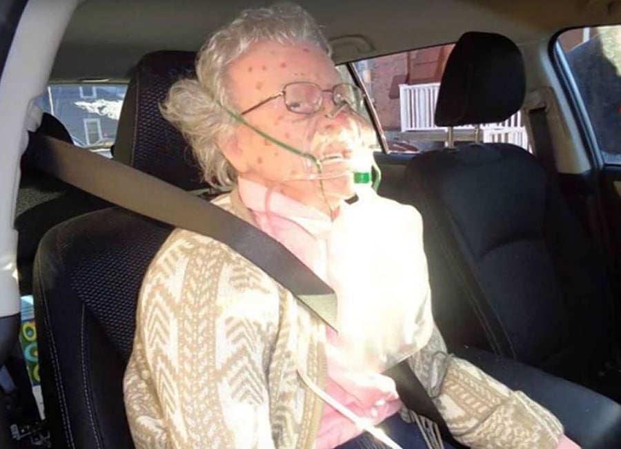 Officers rushed to the scene found a seat-belted figure wearing an oxygen mask sitting motionless in the passenger seat.