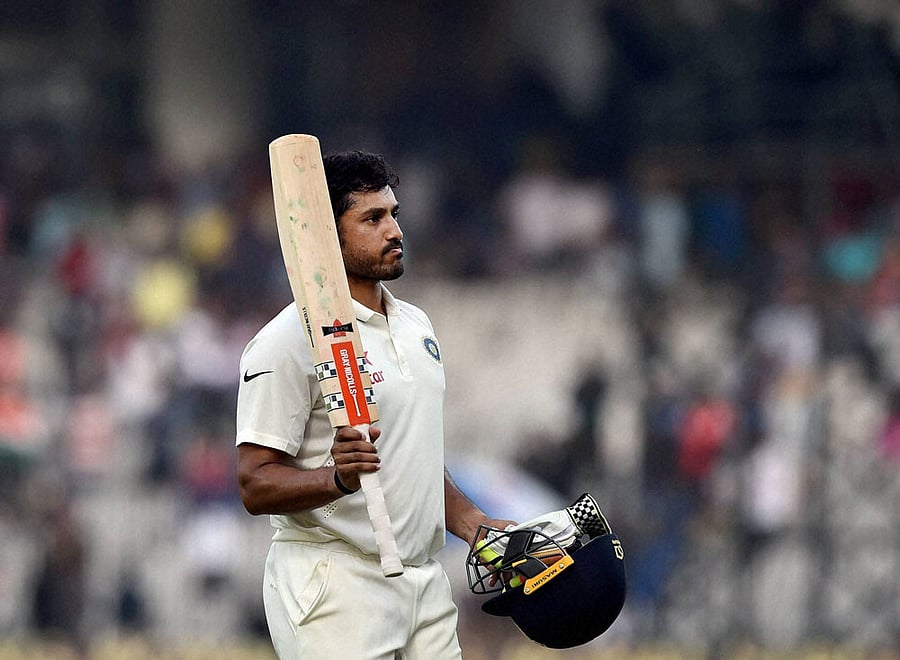 Indian batsman Karun Nair celebrates as he leaves the ground after scoring 300 runs during the fourth day of the fifth cricket test match against England at MAC Stadium, in Chennai on Monday. PTI Photo