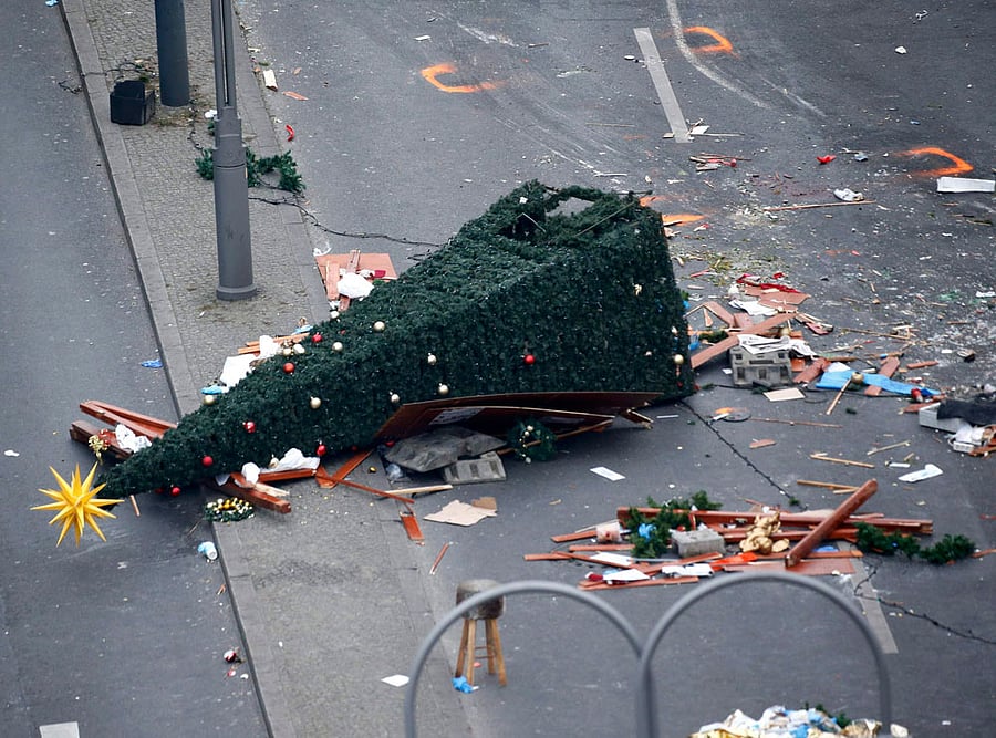 A christmas tree lays on the street beside the empty Christmas market in Berlin, Germany, December 21, 2016, after a truck ploughed through a crowd at the Christmas market on Monday night. REUTERS file photo