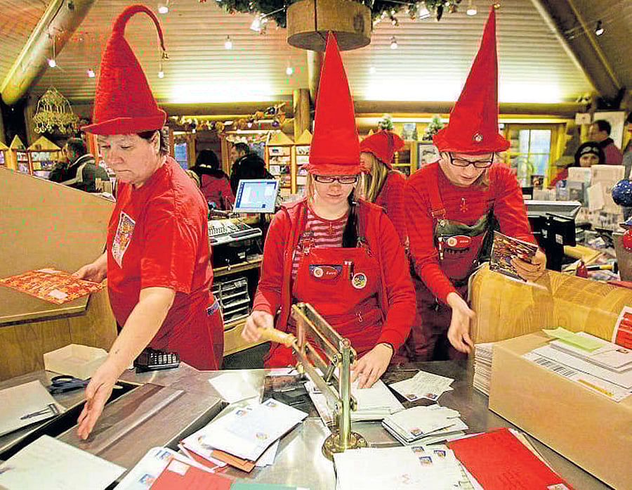 xmas mail Elves sort letters at the Santa Claus Post Office