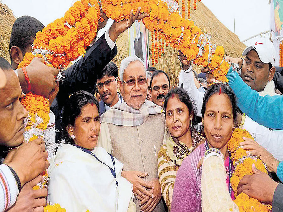 Volunteers greet Bihar Chief Minister Nitish Kumar in Rajgir, Nalanda district, on Thursday. PTI