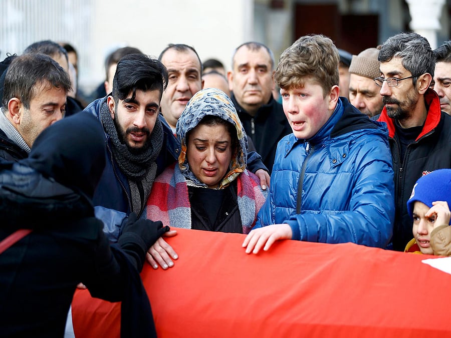 Relatives react at the funeral of Arik, a victim of an attack by a gunman at Reina nightclub, in Istanbul. Reuters photo