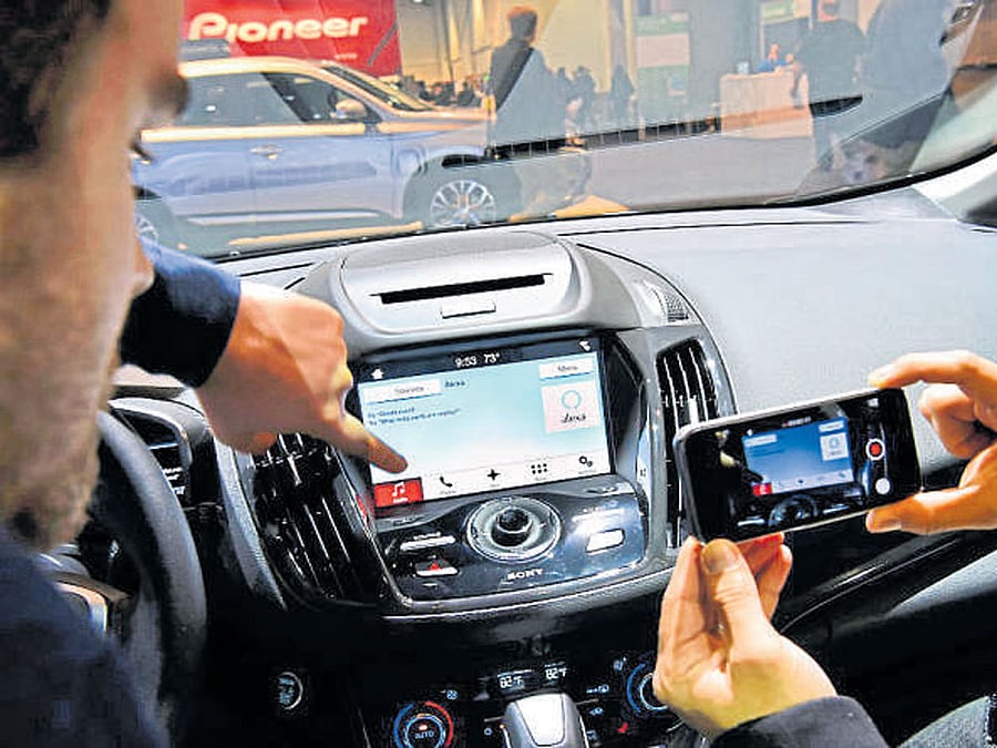 People test Ford's Alexa system at the International Consumer Electronics Show in Las Vegas. INYT