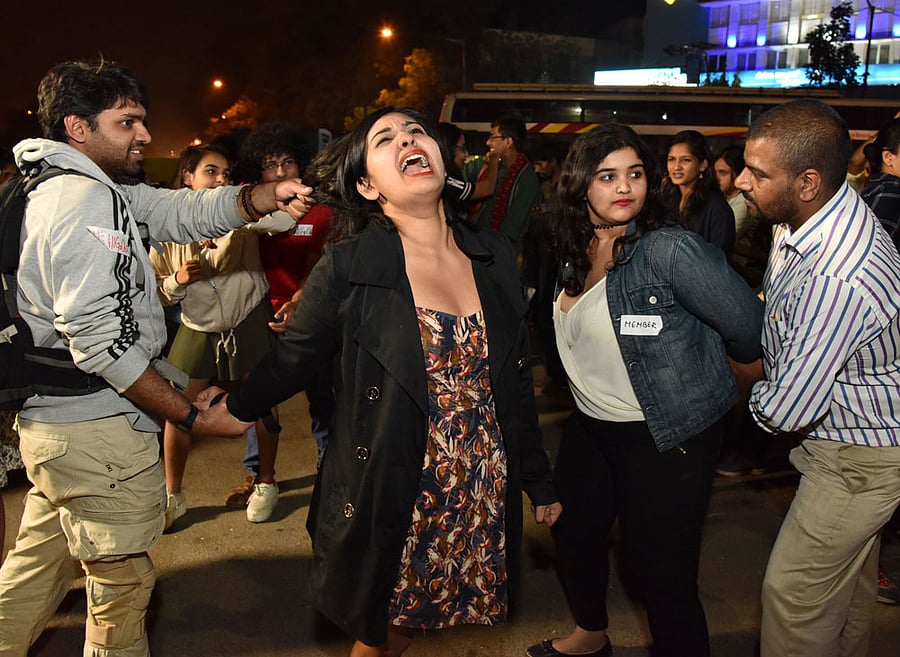 Members of the group 'Night in My Shining Armour' perform a freeze mob during a demonstration against molestation of women in front of Town Hall on Wednesday. DH photo