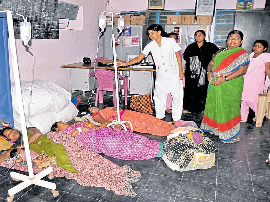Women being treated at Kamalapura primary health  centre in Hosapete taluk on Wednesday. DH photo