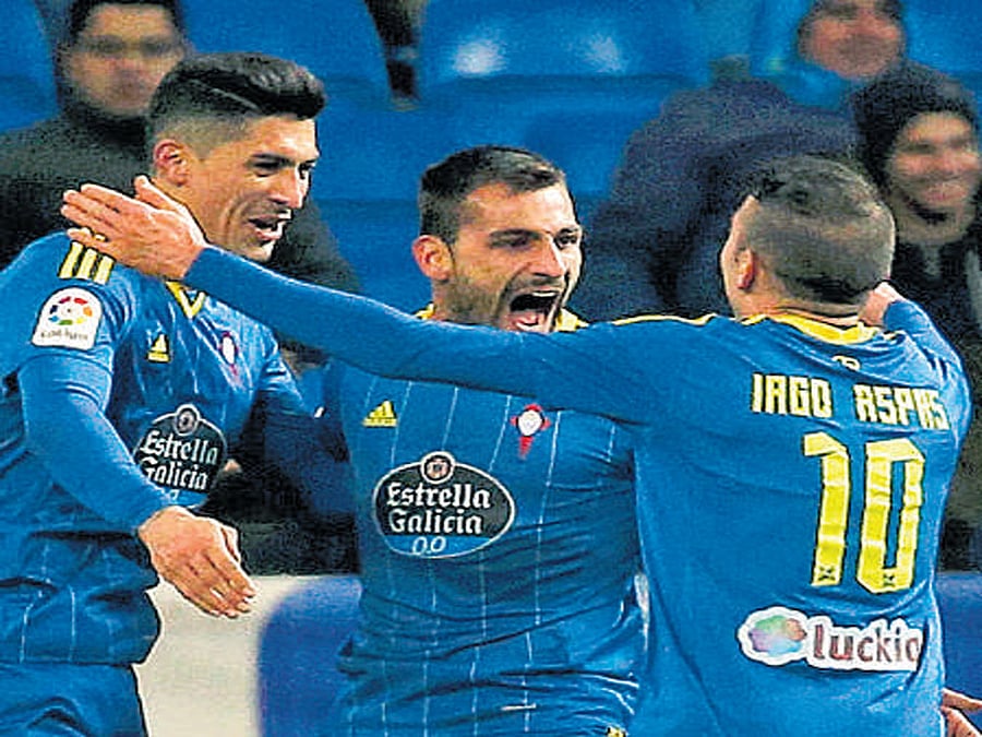 Celta Vigo's Jonny Castro (centre) celebrates with team-mates after scoring against Real Madrid.