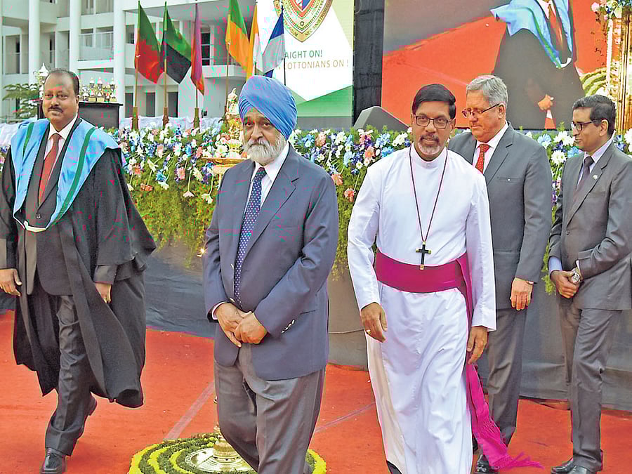 (From left) John K Zachariah, principal, Bishop Cotton Boys' School, Montek Singh Ahluwalia, former deputy chairman, Planning Commission, Rev P K Samuel, Bishop, CSI Karnataka Central Diocese, David Hilton of Anglo Indian Association, and Col D P K Pillay arrive for the Graduation Day of Bishop Cotton Boys' School on Saturday. DH Photo
