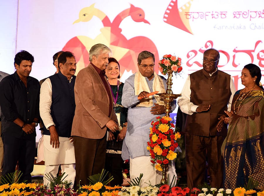 Chief Minister Siddaramaiah inaugurating the 9th edition of Bangalore International Film Festival, in front of Vidhanasoudha in Bengaluru on Thursday. Actor Puneeth Rajkumar, Minister K J George, KCA Chairman S V Rajendra Singh Nbabu, Egyptian Film Maker Hala Khalli, Speaker D H Shankarmurthy and Minister Umashree are also seen. DH Photo/ B H Shivakumar