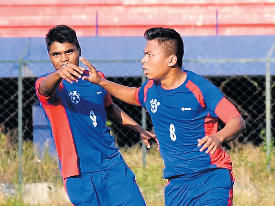 On target MEG's Christopher (right) celebrates with Liton Shil after scoring his side's second goal against CIL. DH photo