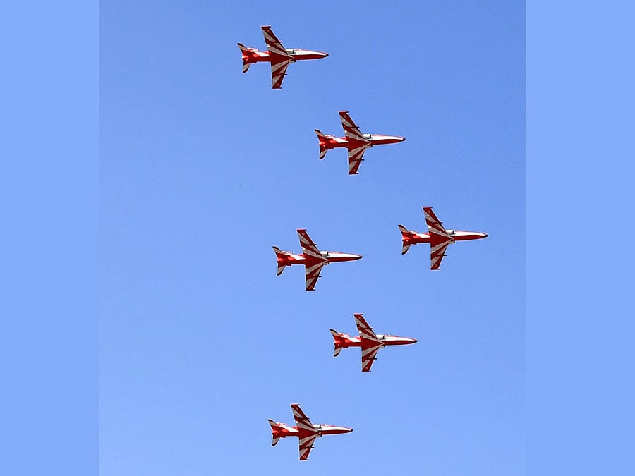 The Suryakiran aerobatic team, flown with Advanced Jet Trainer Hawk, in flight formation rehearsal at the Yelahanka Air Force Station ahead of the Aero India 2017 aerospace and defence exhibition in Bengaluru on Sunday. DH PHOTO by Kishor Kumar Bolar